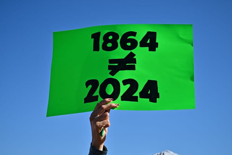 Pro-abortion rights demonstrators rally in Scottsdale, Arizona on April 15, 2024. (Photo by FREDERIC J. BROWN/AFP via Getty Images)