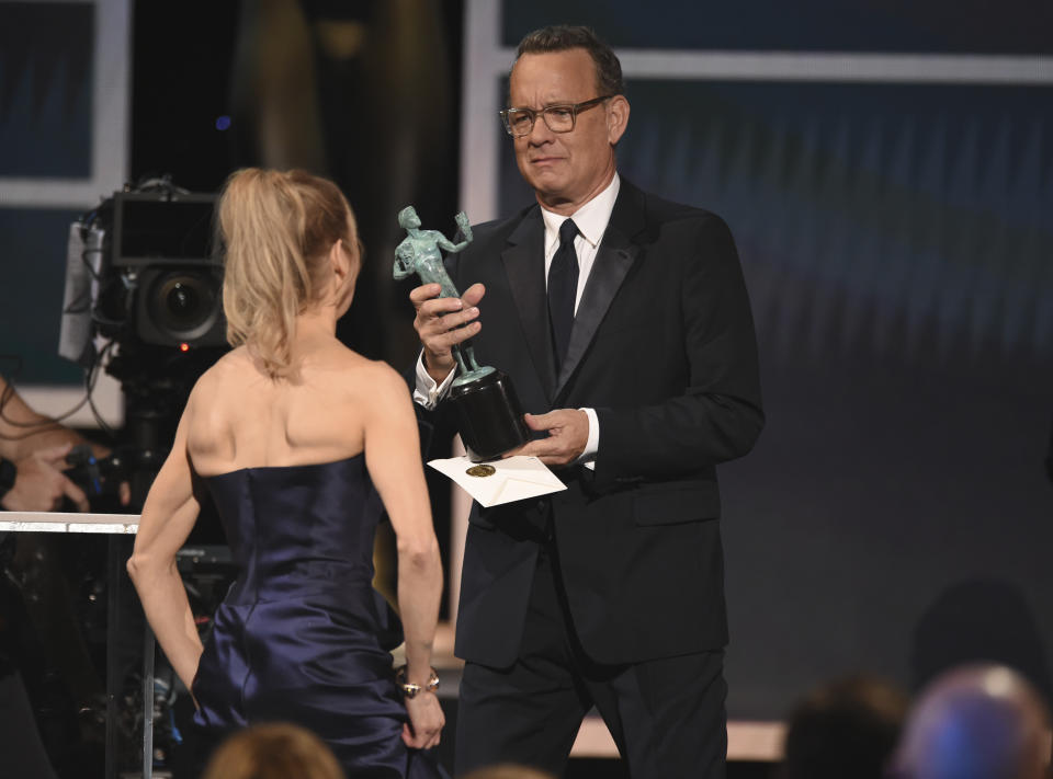 Renee Zellweger, left, accepts the award for outstanding performance by a female actor in a leading role for "Judy" from presenter Tom Hanks at the 26th annual Screen Actors Guild Awards at the Shrine Auditorium & Expo Hall on Sunday, Jan. 19, 2020, in Los Angeles. (Photo/Chris Pizzello)