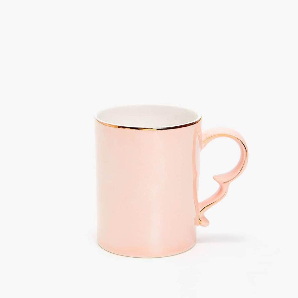 <p>Upgrade your morning coffee game.</p> <p><strong>Shop It Here:</strong> Gold-rimmed porcelain mug, $9.90, <a rel="nofollow noopener" href="https://www.zarahome.com/us/kitchen-&-dining/mugs/gold-rimmed-porcelain-mug-c1020117198p300478900.html?colorId=620&parentId=300483787" target="_blank" data-ylk="slk:zarahome.com;elm:context_link;itc:0;sec:content-canvas" class="link ">zarahome.com</a></p>