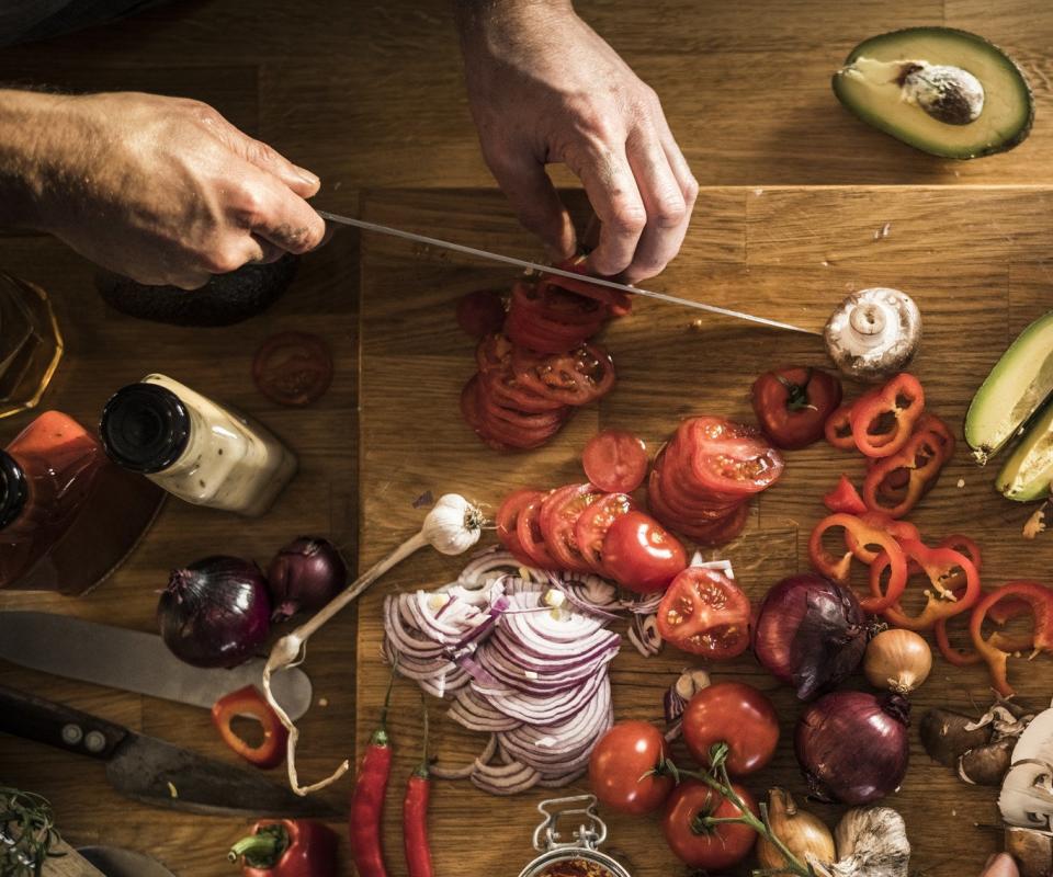 Slicing vegetables for cooking.