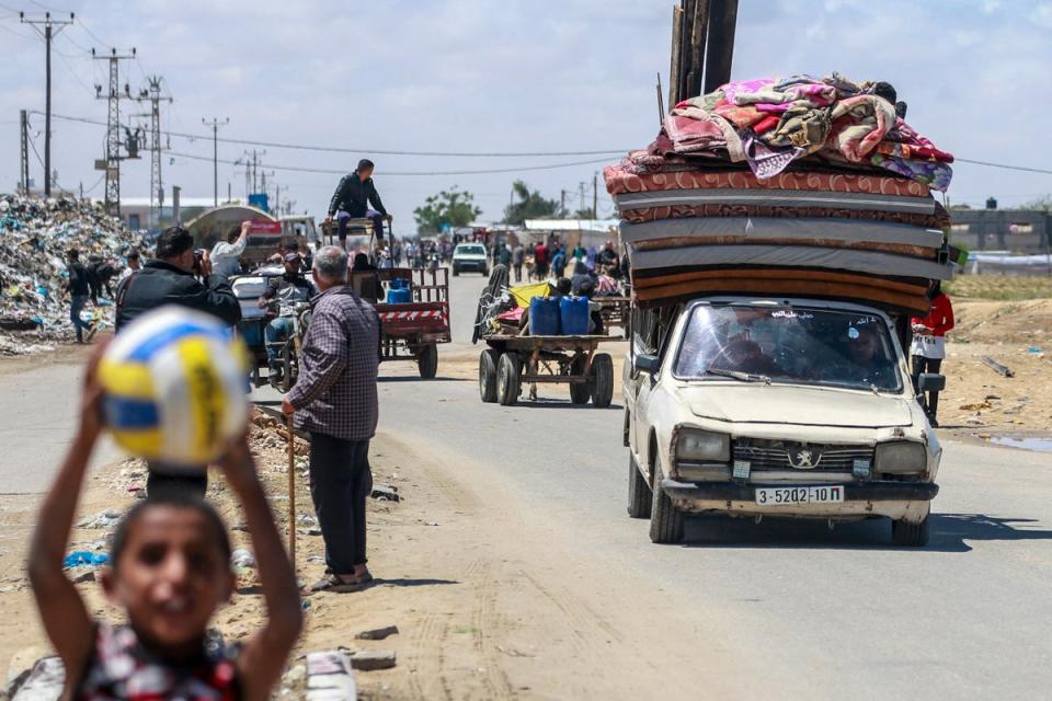Palestinians flee Rafah with mattresses and blankets ahead of a long-anticipated Israeli invasion of the area (AFP/Getty)