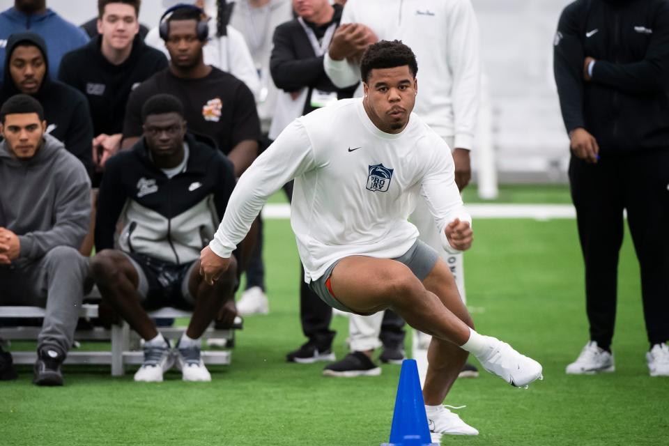 Defensive end Chop Robinson runs through the three-cone drill during Penn State's Pro Day in Holuba Hall on March 15, 2024, in State College.