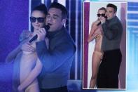 <b>Robbie Williams & Ayda Field</b><br><br>So kannten wir Robbie Williams (38) bisher: Umringt von knapp bis gar nicht bekleideten Schönheiten. Doch Auftritte wie dieser in der italienischen Ausgabe der Casting-Show „X Factor“ im Oktober sind mittlerweile eher die Ausnahme: Der umtriebige Brit-Beau wurde gezähmt! Wer das Unmögliche geschafft hat? Eine Schauspielerin namens… (Bilder: Getty Images)