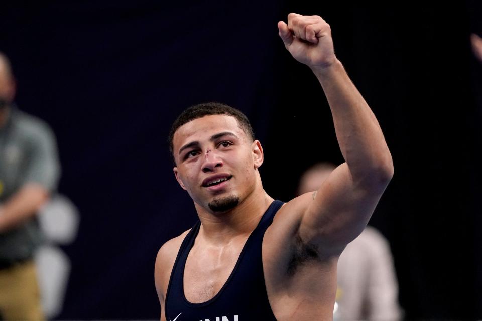 Penn State's Aaron Brooks celebrates after defeating North Carolina State's Trent Hidlay for the 184-pound title at the NCAA wrestling championships March 20, 2021, in St. Louis.