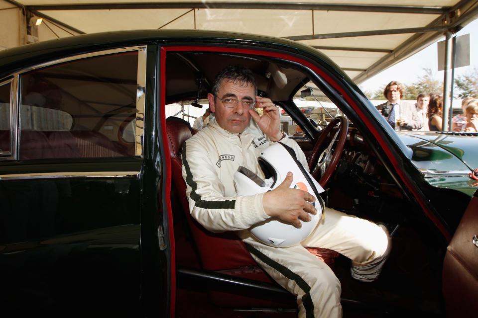 CHICHESTER, UNITED KINGDOM - SEPTEMBER 15:  Actor Rowan Atkinson sits in his car after the St. Mary's trophy during the Goodwood Revival 2012 on September 15, 2012 in Chichester, United Kingdom.  (Photo by Andreas Rentz/Getty Images)