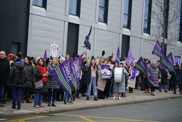 Ambulance workers on the picket line outside Royal Liverpool University Hospital in Liverpool (Peter Byrne/PA)