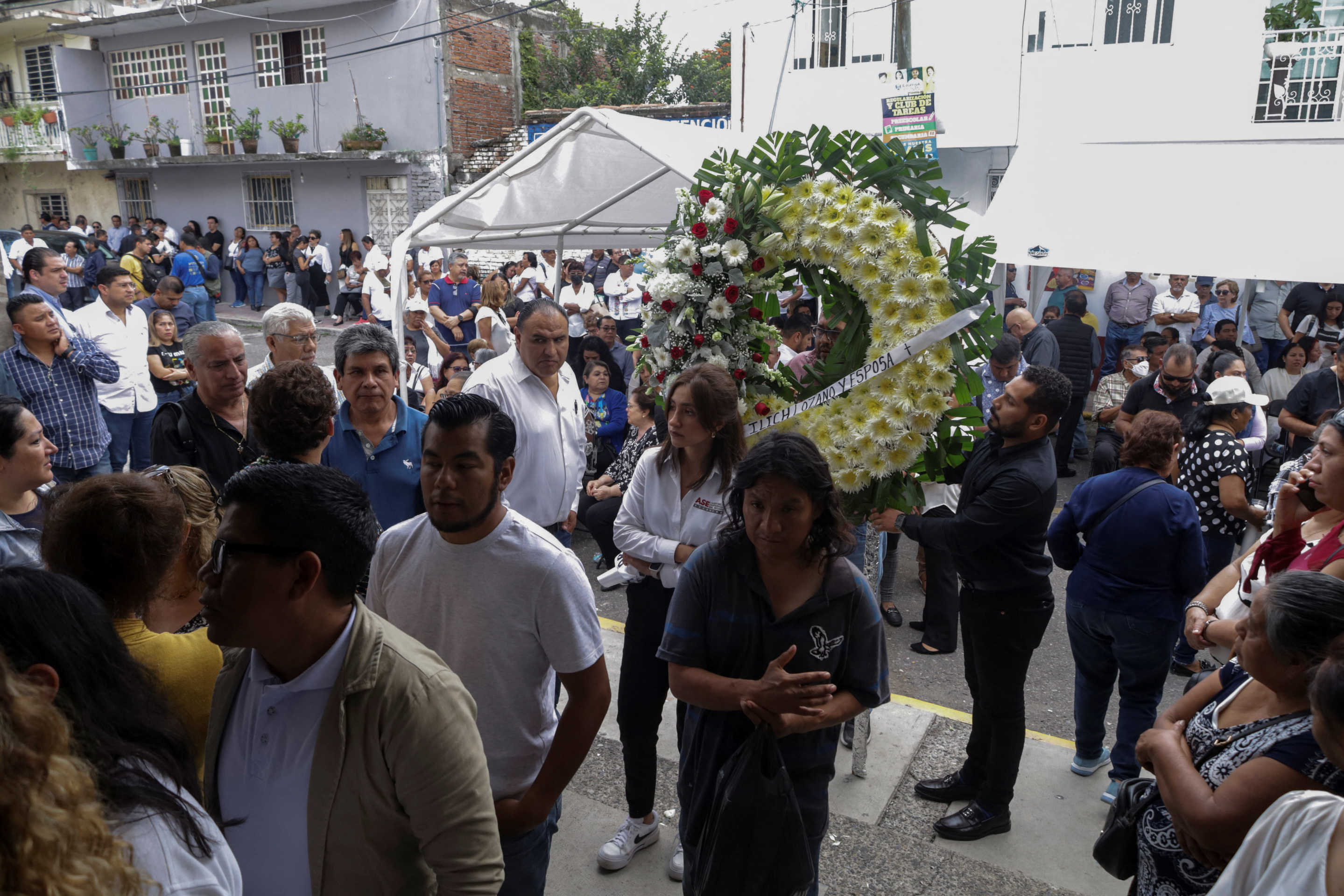 Mourners gather outside a funeral service for Alejandro Arcos, the mayor of Chilpancingo who was killed on Sunday less than a week after taking office, as Mexico's President Claudia Sheinbaum is set to unveil a new security policy, in Chilpancingo, Mexico October 7, 2024. REUTERS/Oscar Ramirez