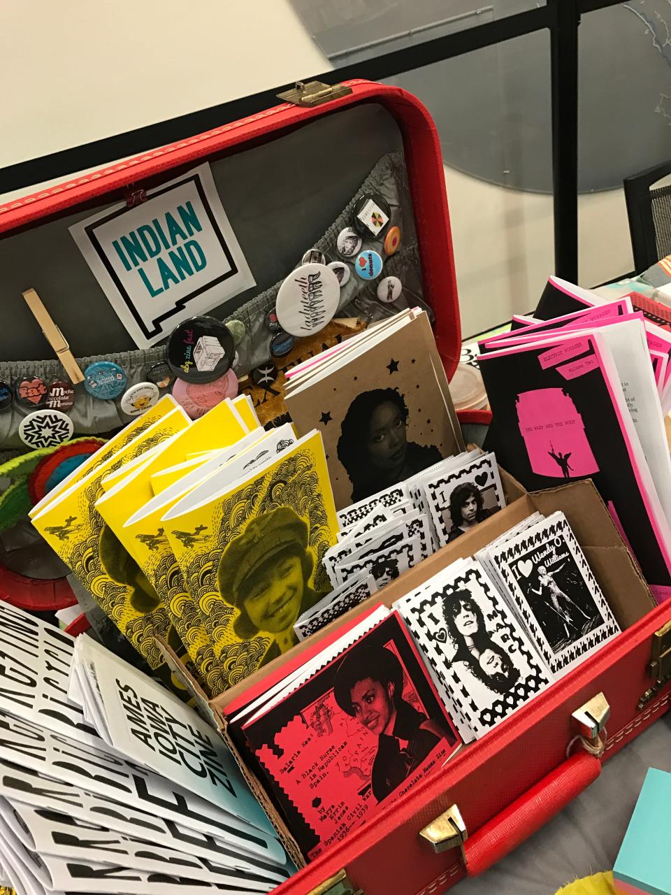 A collection of zines by Marya Errin Jones are arranged in a case. Jones, founder of the ABQ Zine Fest, said she’s often one of the only Black women at some zine festivals and events.