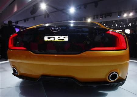 Rear view of the Kia GT4 Stinger concept car as it is displayed during the press preview day of the North American International Auto Show in Detroit, Michigan January 13, 2014. REUTERS/Joshua Lott