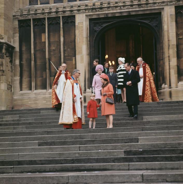<p>Queen Elizabeth sports a salmon suit on the steps of St George's Chapel in Windsor. The royal family stops to greet the clergy as they leave Christmas Day service.</p>