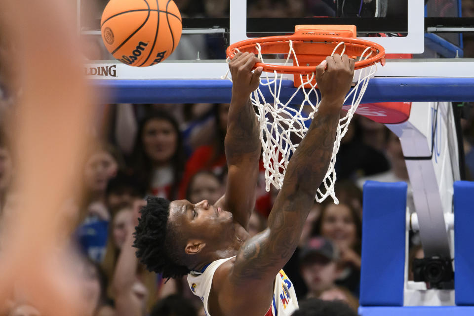 Kansas forward K.J. Adams Jr. is fouled making him miss this dunk against Baylor during the second half of an NCAA college basketball game in Lawrence, Kan., Saturday, Feb. 10, 2024. (AP Photo/Reed Hoffmann)