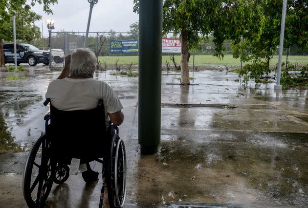 A man looks at a flooded road in Salinas, Puerto Rico, on Monday. (Photo: JOSE RODRIGUEZ via Getty Images)