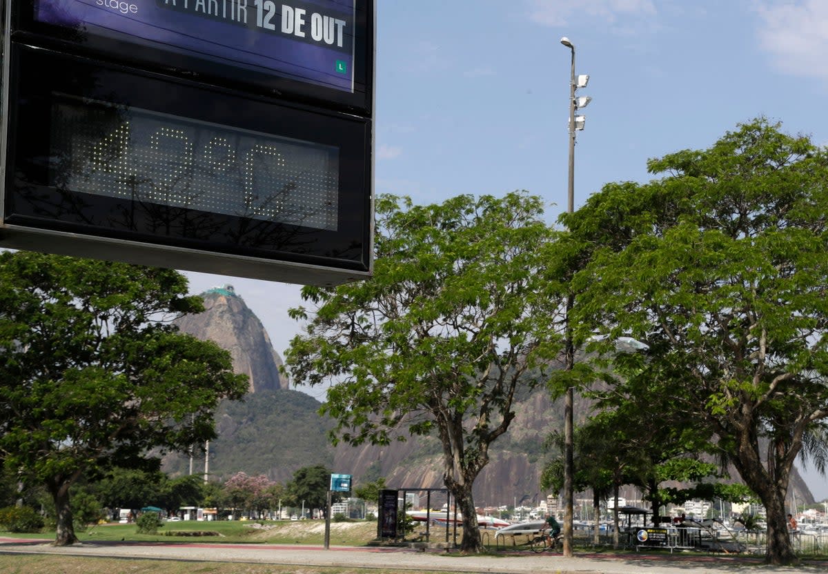 A digital sign displays the temperature at 42C in Rio de Janeiro, Brazil (AP)
