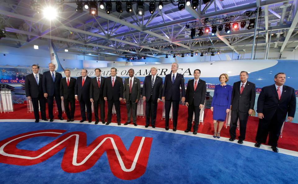 Republican presidential candidates, from left, Rick Santorum, George Pataki,  Rand Paul, Mike Huckabee, Marco Rubio, Ted Cruz, Ben Carson, Donald Trump, Jeb Bush, Scott Walker, Carly Fiorina, John Kasich and Chris Christie take the stage during the CNN Republican presidential debate at the Reagan library on Sept. 16, 2015, in Simi Valley, Calif.