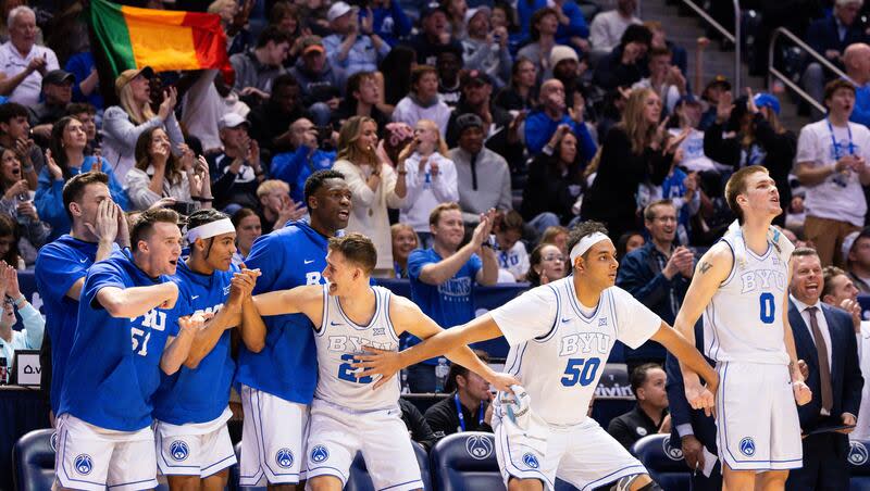 BYU players react excitedly from the bench during game with TCU at the Marriott Center in Provo on Saturday, March 2, 2024.