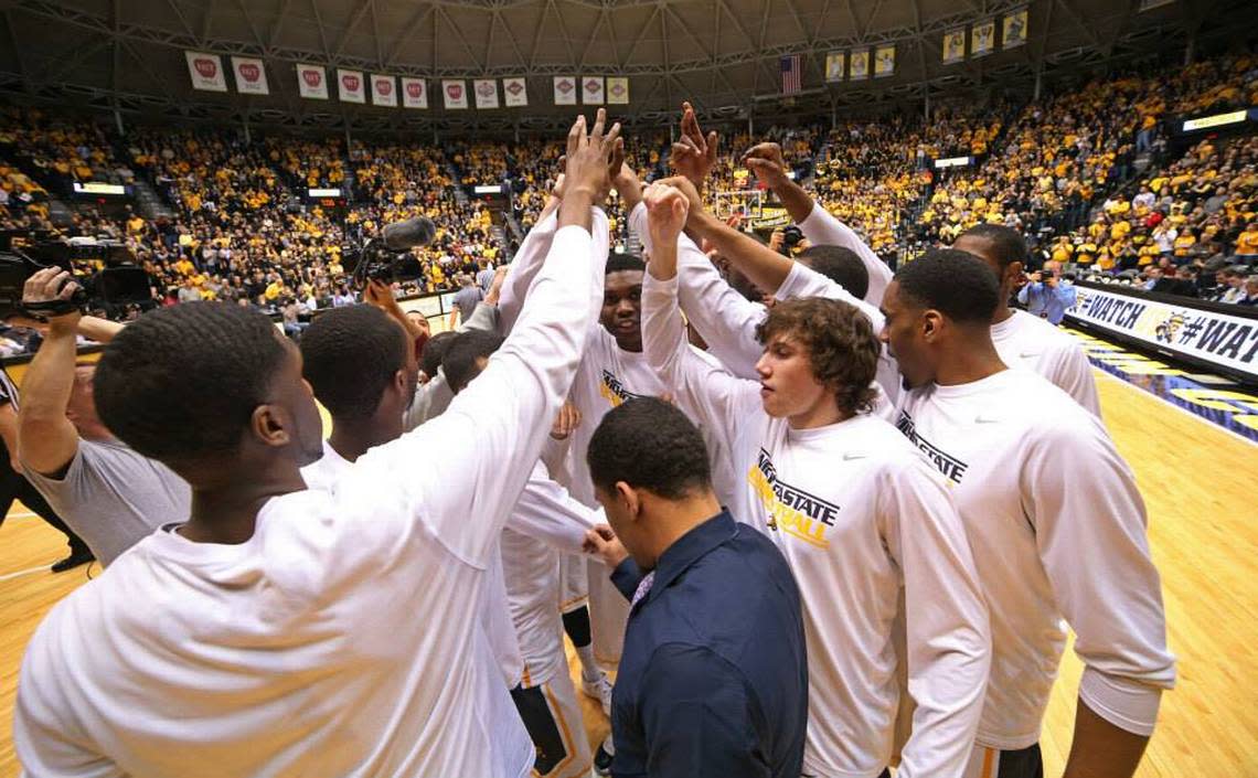 Despite a heart condition that ended his basketball career before the 2013-14 season, D.J. Bowles (blue shirt) was still included in team activities by his Wichita State teammates.