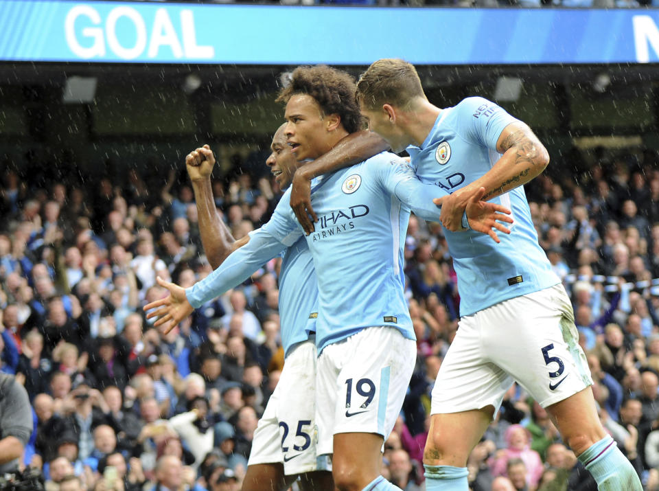 Leroy Sane, Fernandinho and John Stones celebrate City’s fifth goal