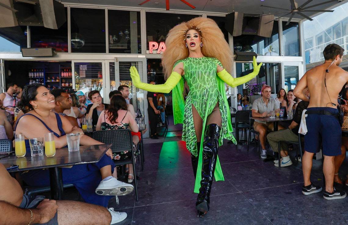 A performer dances at the Palace Bar & Restaurant on Ocean Drive in South Beach during spring break on Miami Beach, Florida on Saturday, March 16, 2024.