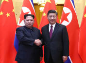 <p>North Korean leader Kim Jong Un and Chinese President Xi Jinping shake hands at the Great Hall of the People in Beijing, China, in this picture released to Reuters on March 28, 2018. (Photo: Ju Peng/Xinhua via Reuters) </p>