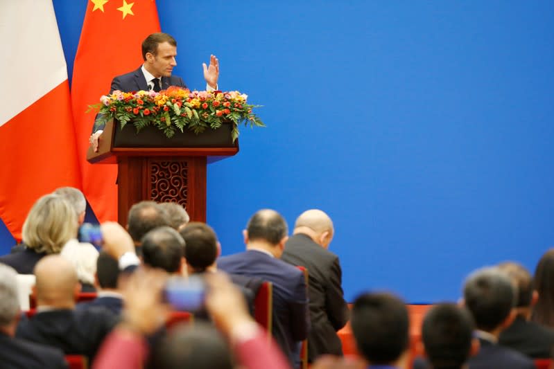 French President Emmanuel Macron speaks at a China-France Economic Forum at the Great Hall of the People in Beijing