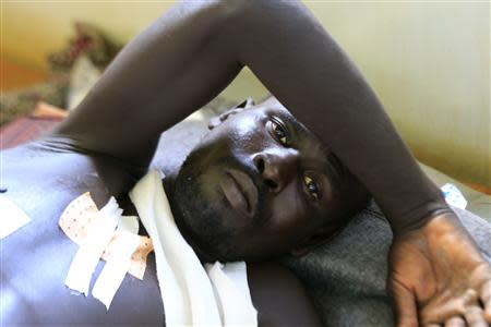 A displaced man, undergoing treatments for his injuries, is seen at a United Nations hospital at Tomping camp, where some 15,000 displaced people who fled their homes are sheltered by the UN near South Sudan's capital Juba January 7, 2014. REUTERS/James Akena