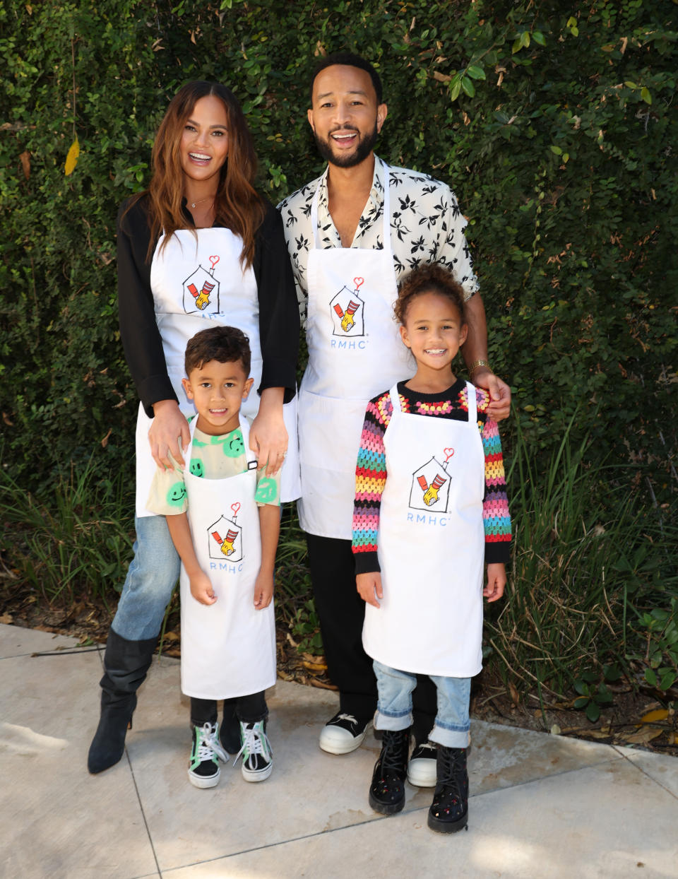 LOS ANGELES, CALIFORNIA - NOVEMBER 12: Chrissy Teigen and John Legend with son Miles and daughter Luna as John partners with Ronald McDonald House Charities (RMHC) For The Season Of Giving at Ronald McDonald House Charities on November 12, 2023 in Los Angeles, California. (Photo by Jerritt Clark/Getty Images for RMHC )