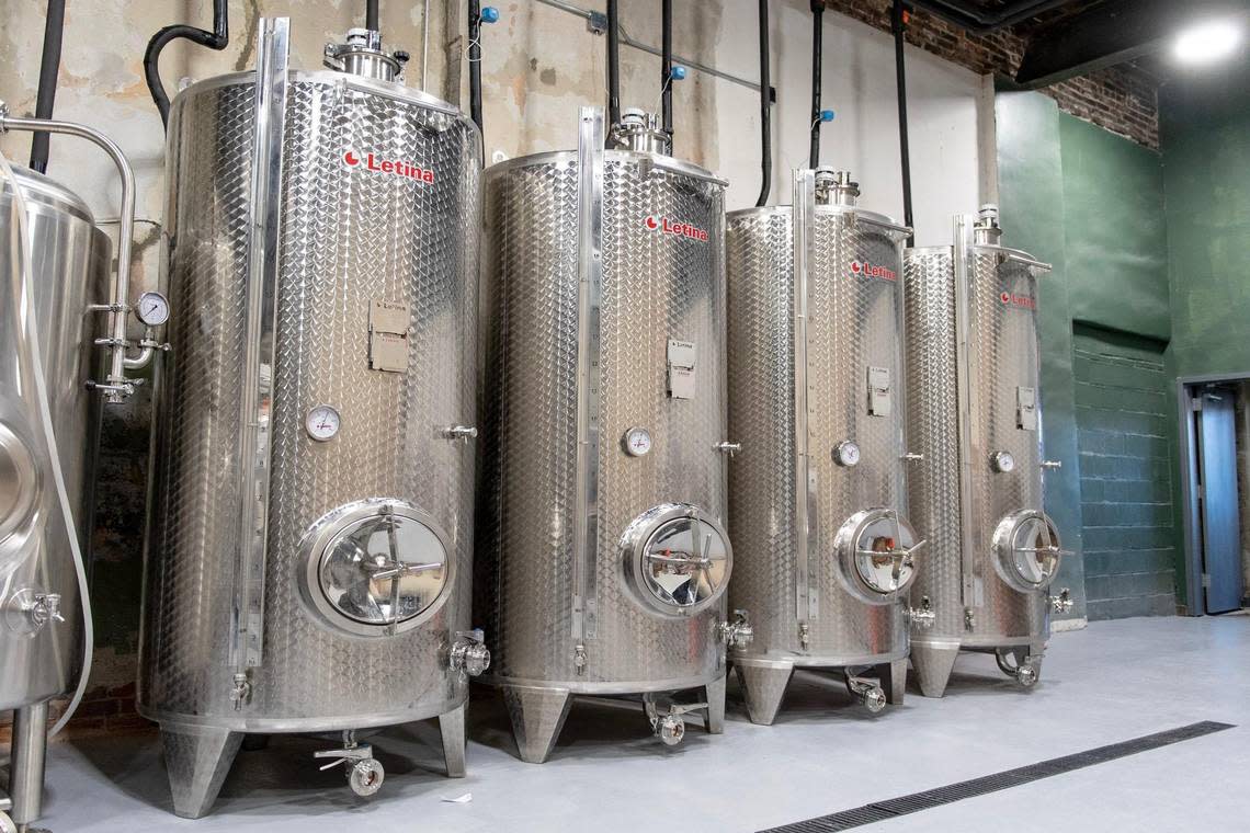 Four cider fermenters line a wall in the production room at Brick River Cider Co. on Monday, Nov. 21, 2022 in Kansas City.