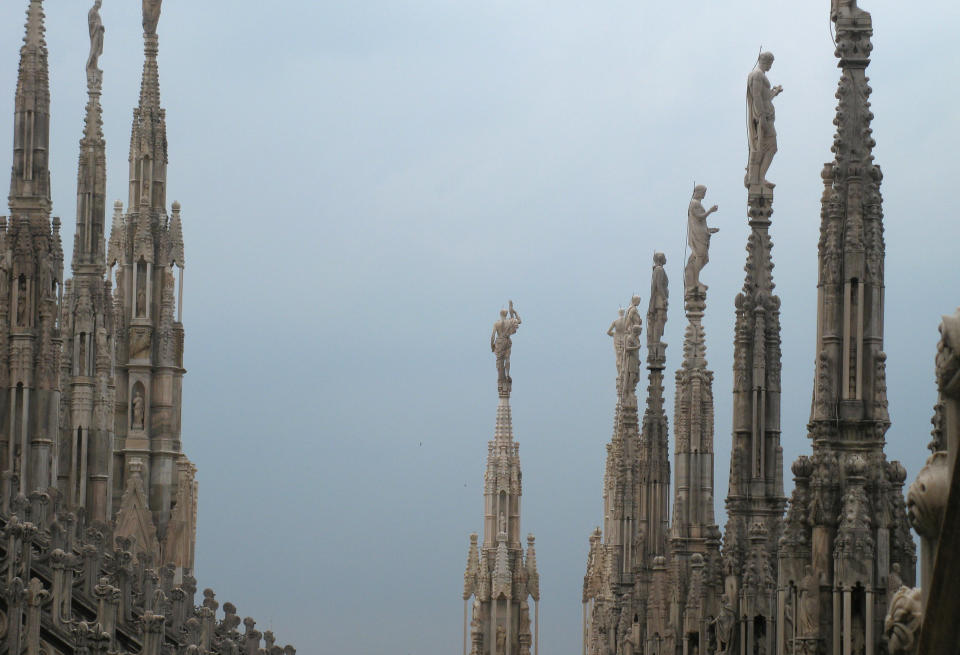 This July 6, 2012 photo shows spires of the Milan cathedral against the threatening skies in Milan, Italy. To travel through northern Italy with a copy of Mark Twain’s 1869 ‘'The Innocents Abroad', his classic 'record of a pleasure trip'. It took him to the great sights of Europe and on to Constantinople and Jerusalem before he sailed home to New York. Such a trip would take far too big a chunk out of my holiday time. But, Milan, Florence and Venice, a mere fragment for Twain, was within my reach for a two-week vacation. (AP Photo/Raf Casert)