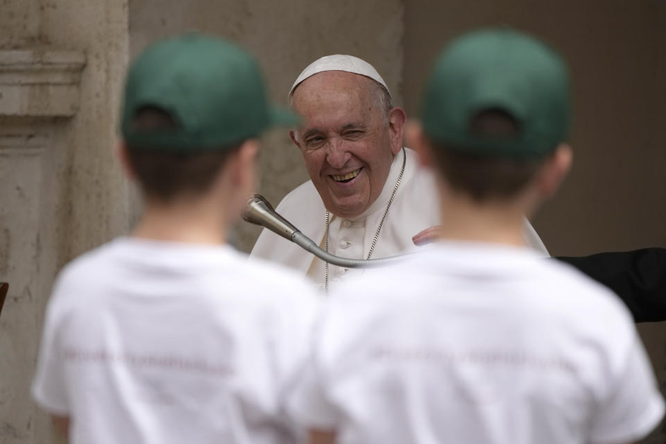 Pope Francis listens to children's questions during an audience in the San Damaso courtyard at the Vatican, Saturday, June 4, 2022. Pope Francis met about 160 children of the Sant'Alessio- Margherita di Savoia care institution for blind, visually impaired, or with other disabilities and a group of children refugee from Ukraine. (AP Photo/Alessandra Tarantino)