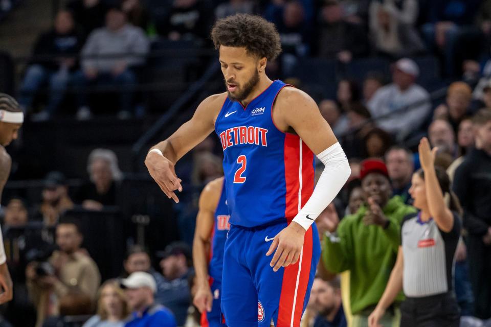 Detroit Pistons guard Cade Cunningham (2) celebrates after making a three point shot against the Minnesota Timberwolves in the first half at Target Center in Minneapolis on Wednesday, March 27, 2024.