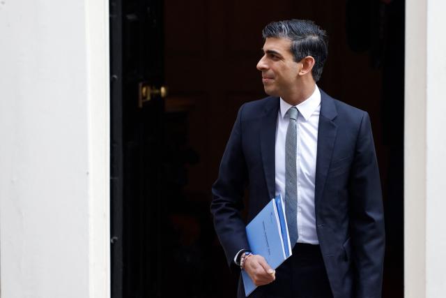 Britain&#39;s Chancellor of the Exchequer Rishi Sunak leaves the 11 Downing Street, in London, on March 23, 2022. - Rishi Sunak will announce budget updates before parliament at about 1245 GMT, on March 23, 2022. (Photo by Tolga Akmen / AFP) (Photo by TOLGA AKMEN/AFP via Getty Images)