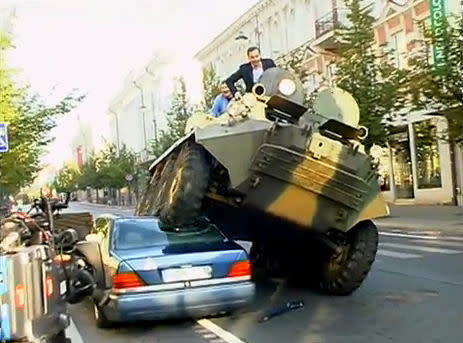 Mayor crushes illegally parked car with tank (Screengrab)