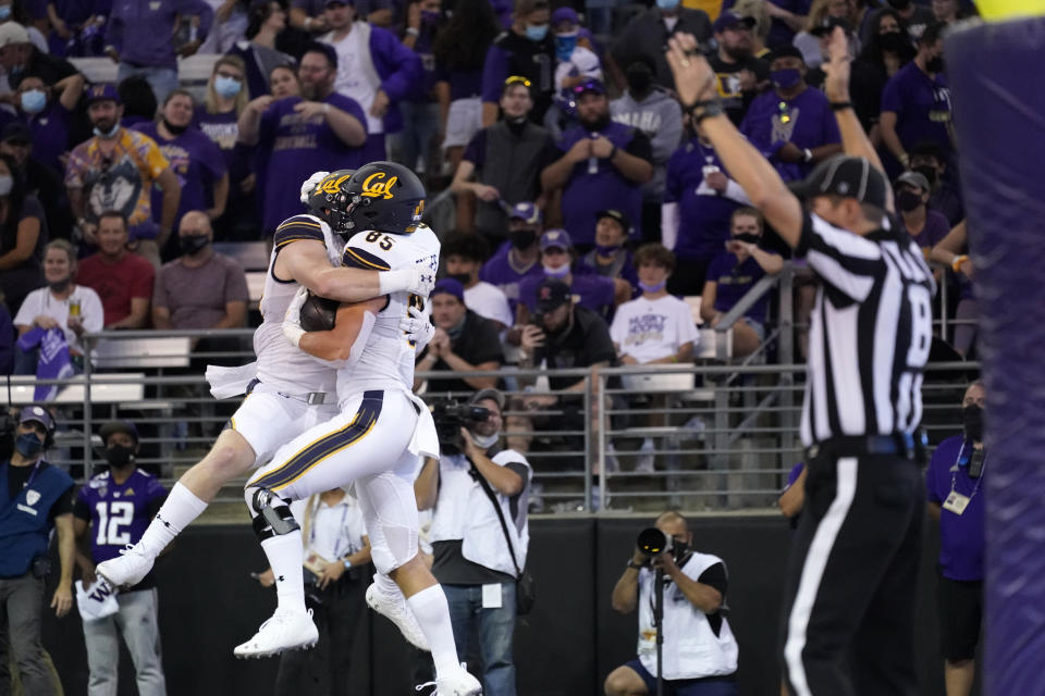 California's Jake Tonges (85) celebrates his touchdown reception with Gavin Reinwald against Washington in the first half of an NCAA college football game Saturday, Sept. 25, 2021, in Seattle. (AP Photo/Elaine Thompson)