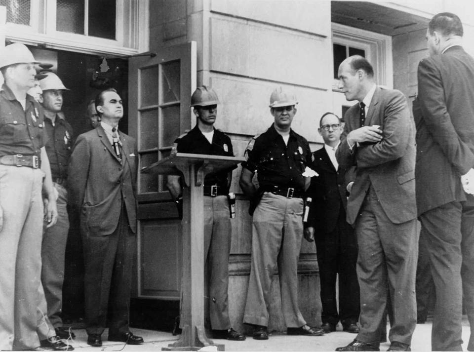 Former Alabama Gov. George Wallace stands in front of a University of Alabama building in Tuscaloosa to keep black students from enrolling in 1963.