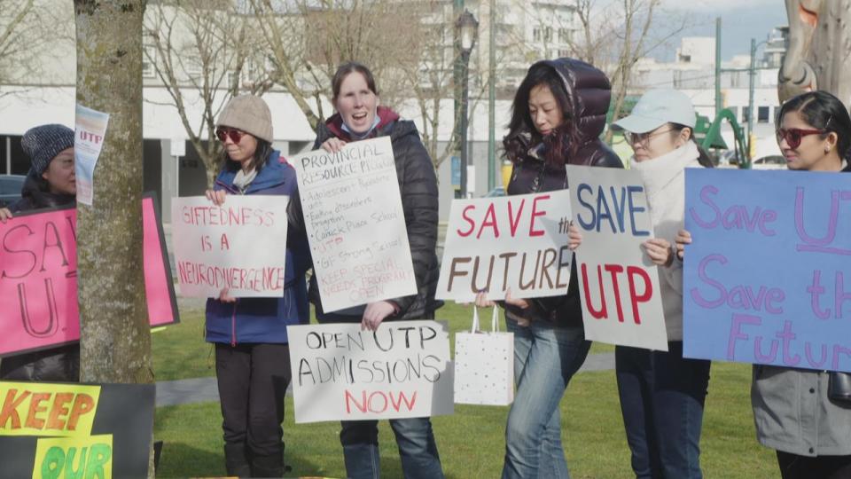 Parents rallied outside of the Vancouver School Board offices on Wednesday in support of a gifted learners program.  (GP Mendoza/CBC - image credit)