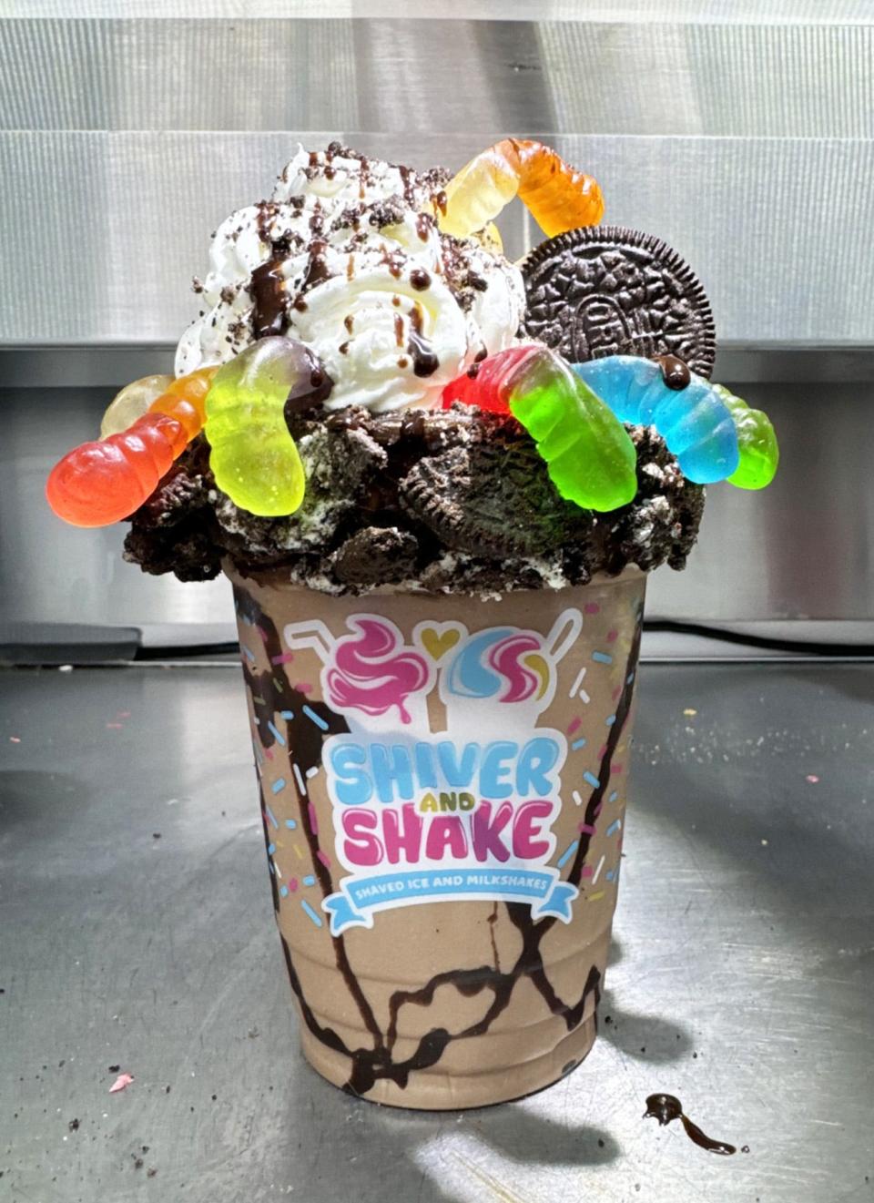 This dirt cake themed shake features gummy worms and Oreo cookies.