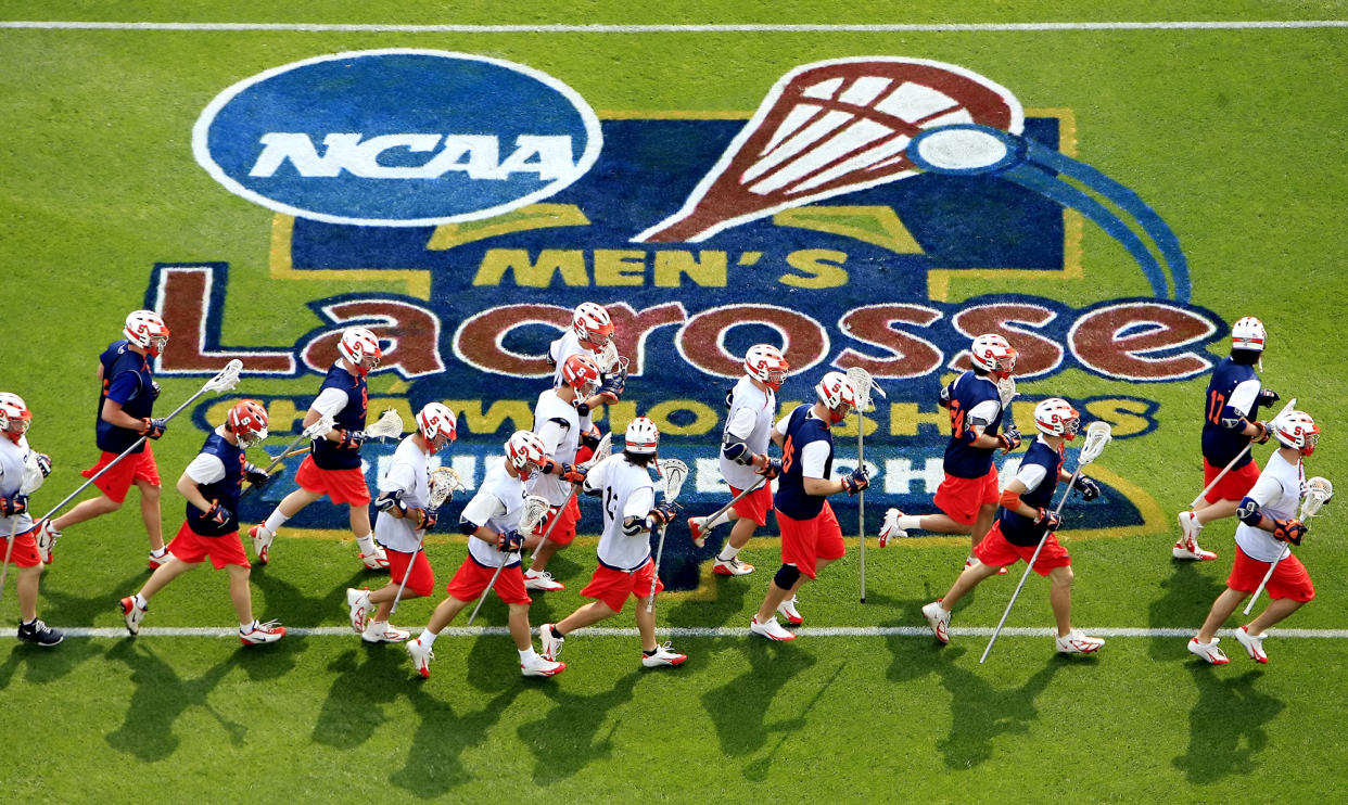 Members of the Syracuse University men's lacrosse team practice Friday, May 26, 2006, in preparation for their match with Virginia in the semifinals of the NCAA Men's Lacrosse Division I semifinals Saturday, at Lincoln financial Field in Philadelphia.  (AP Photo/Matt Rourke)