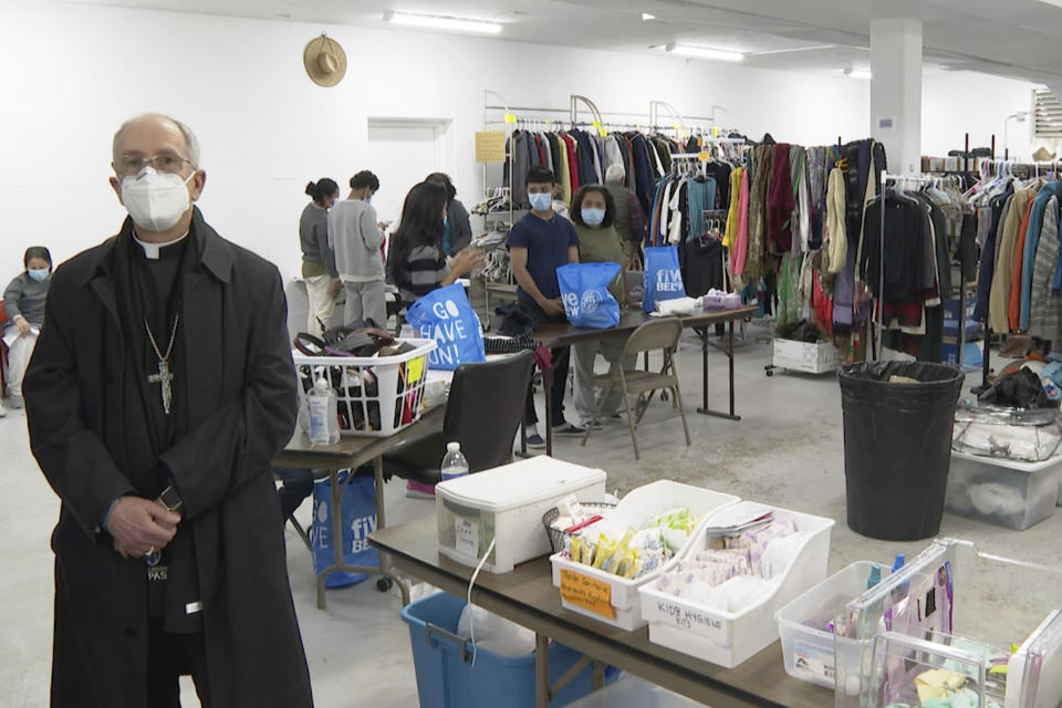 The Most Rev. Mark Seitz, the Catholic bishop of El Paso, Texas, stands for a portrait near supplies and clothes in a shelter for migrants on the grounds of the Catholic Diocese of El Paso in El Paso, Texas, on Monday, Dec. 19, 2022. “I think most people would be surprised, and I hope pleasantly surprised, to see the degree of unanimity among the bishops on this question of immigration,” Seitz says. “So many of the bishops have come up to me and expressed … a concern about how we need to better to welcome [migrants].” (AP Photo/Lekan Oyekanmi)