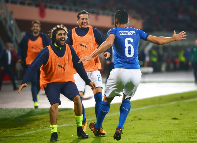 Italy's Antonio Candreva celebrates with teammates after scoring a goal during their FIFA 2018 World Cup qualification match against Albania, in Shkoder, on October 9, 2017