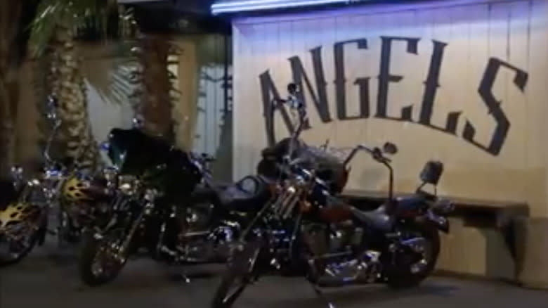 motorcycles parked outside Angels Bar