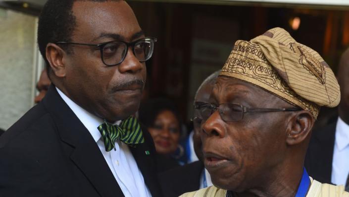 African Development Bank (AfDB) President Akinwumi Adesina (left) talks to former Nigerian President Olusegun Obasanjo in 2017