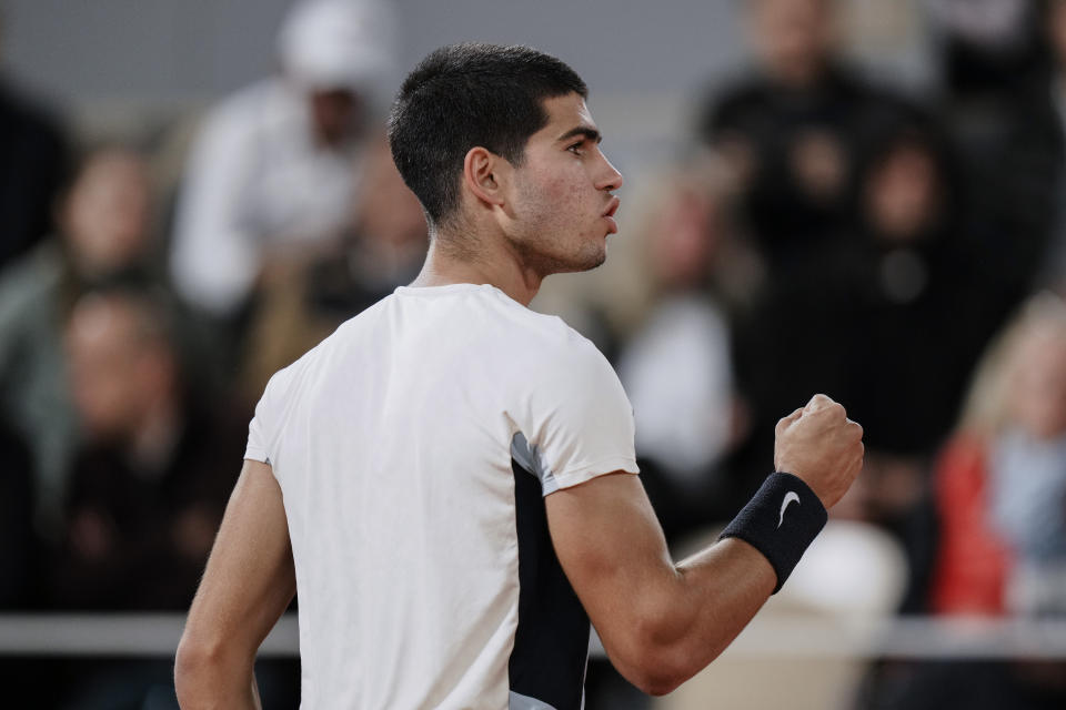 Spain's Carlos Alcaraz clenches his fist after scoring a point against Russia's Karen Khachanov during their fourth round match at the French Open tennis tournament in Roland Garros stadium in Paris, France, Sunday, May 29, 2022. (AP Photo/Thibault Camus)