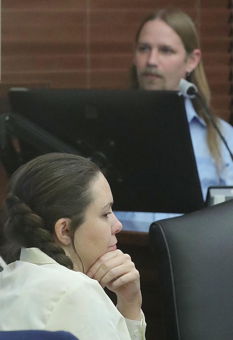 Erica Stefanko, left, listens to testimony from her husband Mike Stefanko on Monday, Jan. 29, 2024, in Akron, Ohio. Erica is being retried for her role in the 2012 murder of pizza delivery driver Ashley Biggs. Mike was called by the defense to testify. [Phil Masturzo/ Beacon Journal]