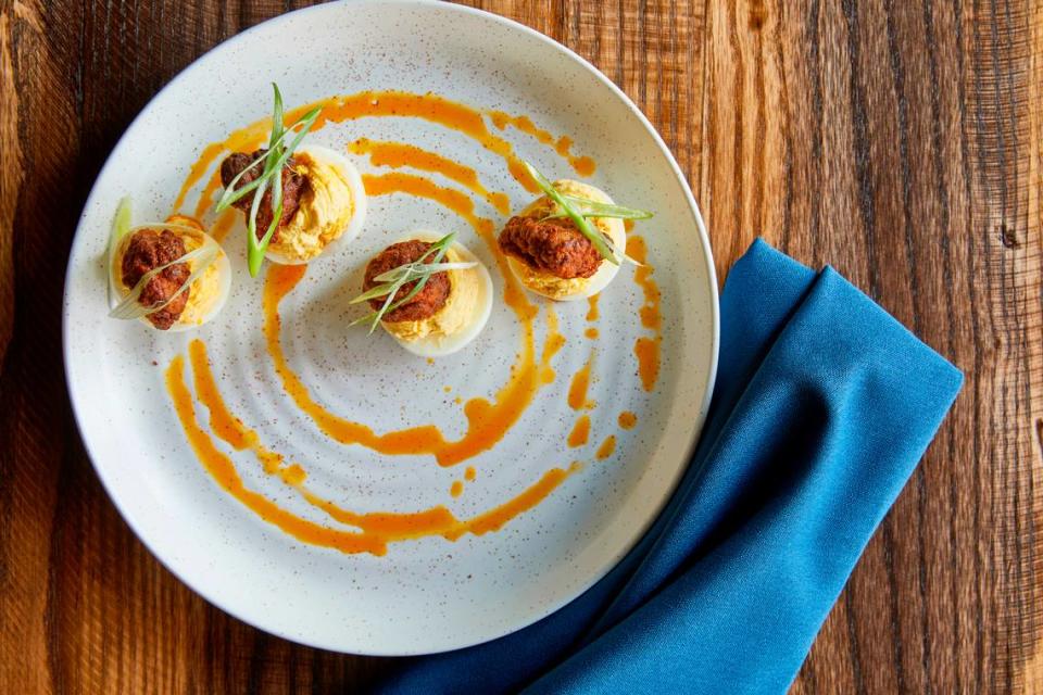 Golden Owl Tavern’s Deviled Eggs are topped with a nugget of Nashville hot chicken.