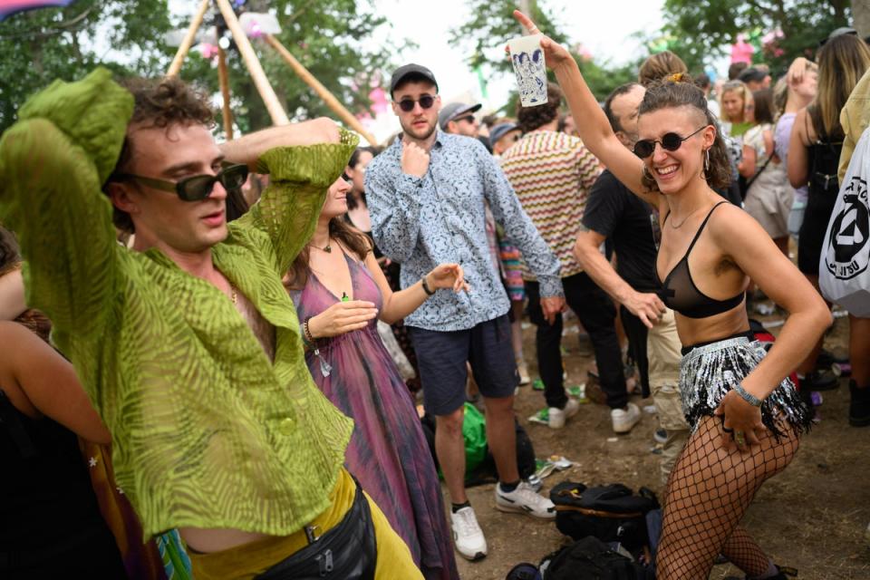 Festival-goers dance to the Hippo Sound System at the Glade Dome stage on Thursday (Getty)