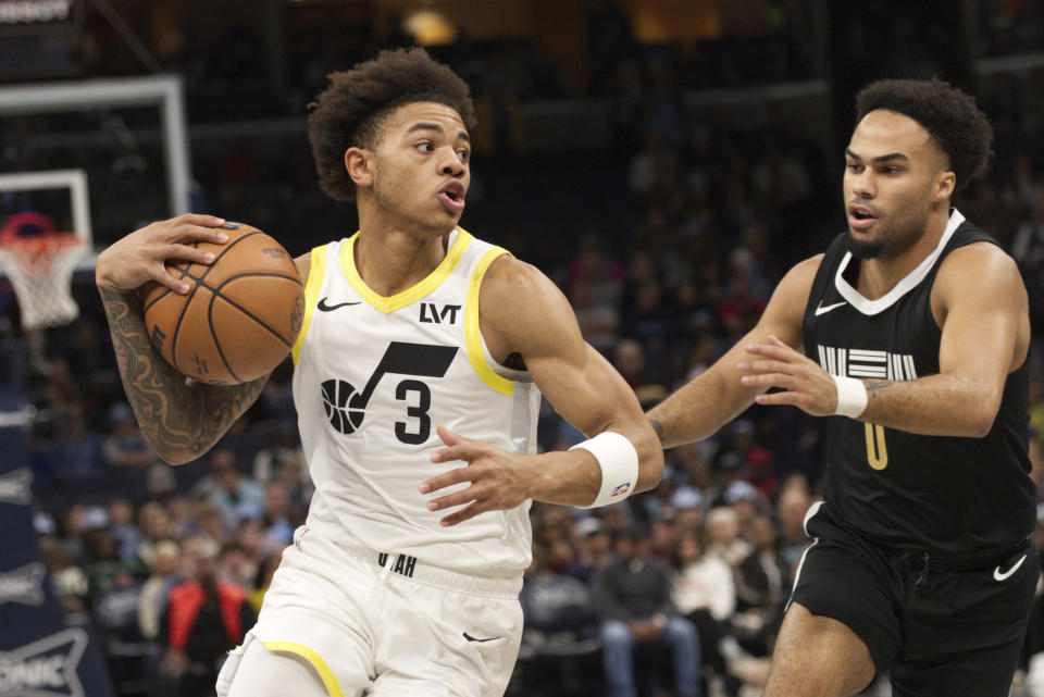 Utah Jazz guard Keyonte George (3) drives against Memphis Grizzlies guard Jacob Gilyard (0) during the first half of an NBA basketball in-season tournament game Friday, Nov. 10, 2023, in Memphis, Tenn. (AP Photo/Nikki Boertman)