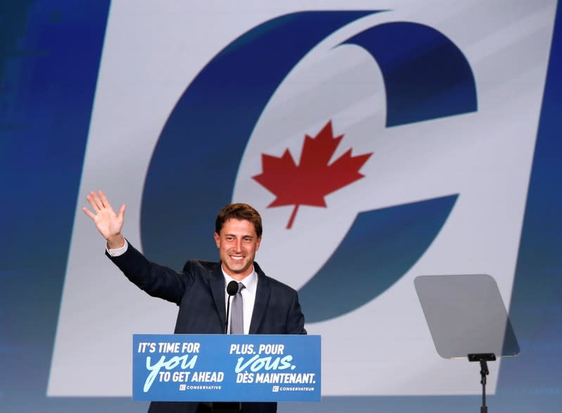 Conservative candidate Michael Kram waves to supporters after he defeated Liberal MP Ralph Goodale in the federal election in Regina