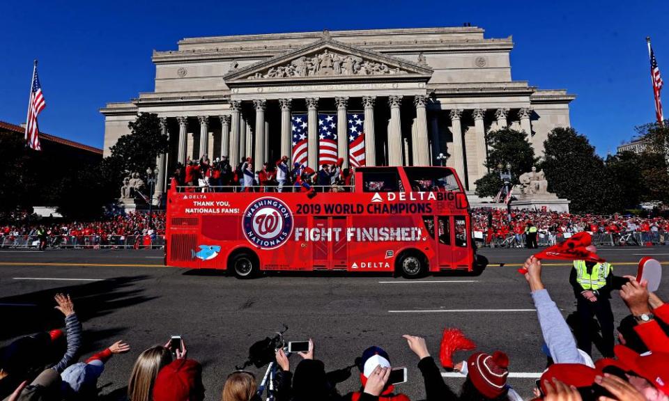 The Nationals parade moves past the National Archives on Constitution Avenue, near the National Mall.