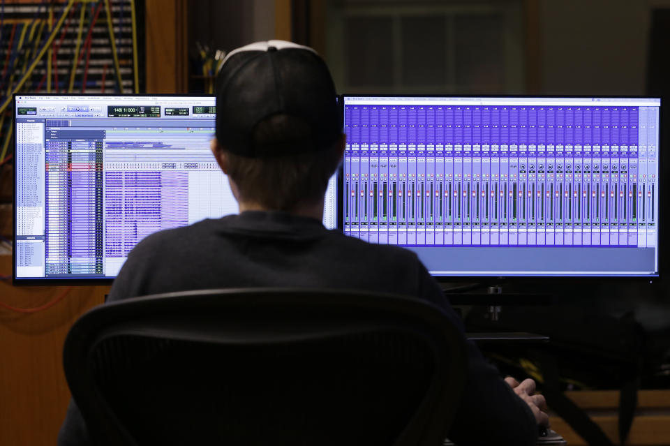 In this Oct. 21, 2019, photo, the recording of a video game soundtrack is monitored in Nashville, Tenn. Music City is earning a new reputation as Soundtrack City. And more production companies, including Netflix, Showtime, Sony and Focus Features, have been lured to Nashville to record music for movies, TV and video games in the last year thanks to a new incentive program. (AP Photo/Mark Humphrey)