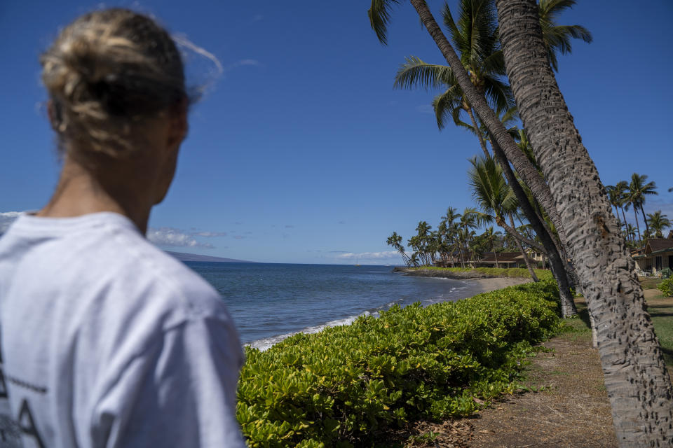 Daniel Skousen looks at the beach near his home on Friday, Nov. 3, 2023, in Lahaina, Hawaii. Skousen used to swim in the ocean daily, but since August's wildfire, he has only been back in the water once. (AP Photo/Mengshin Lin)